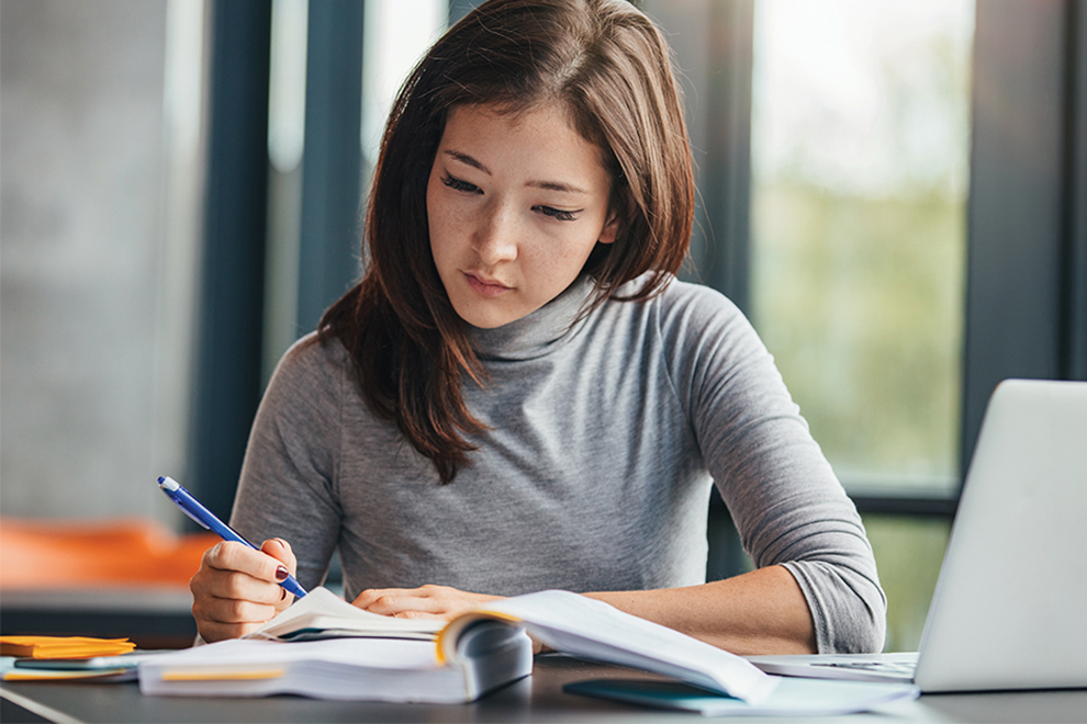 female Asian college student studying